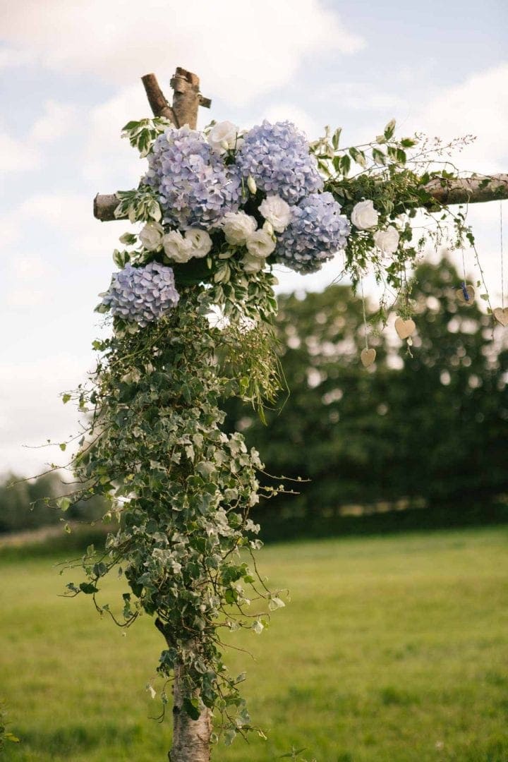 flowery alter at outdoor wedding