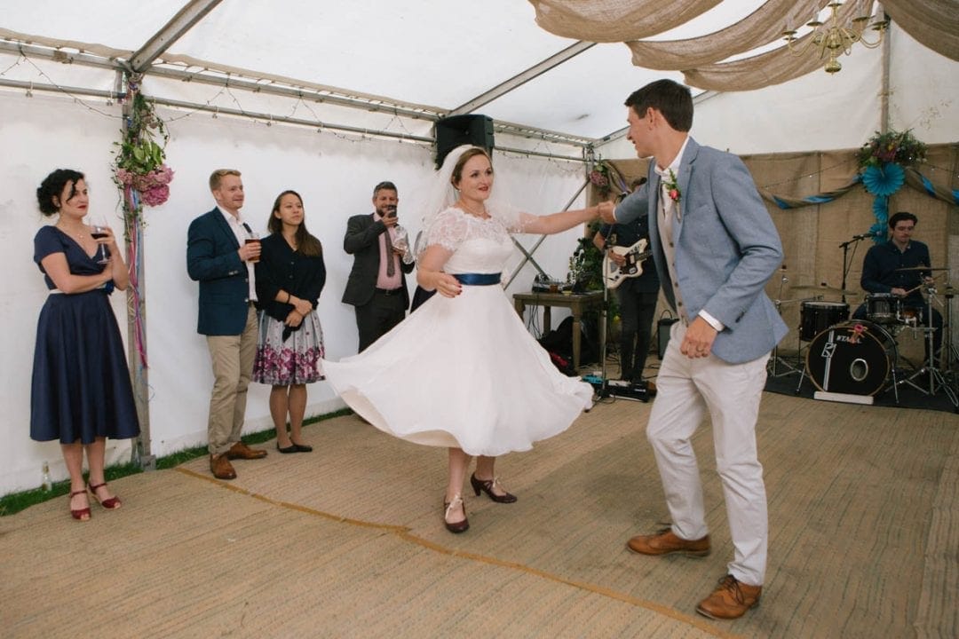 Bride and groom's first dance in a marquee
