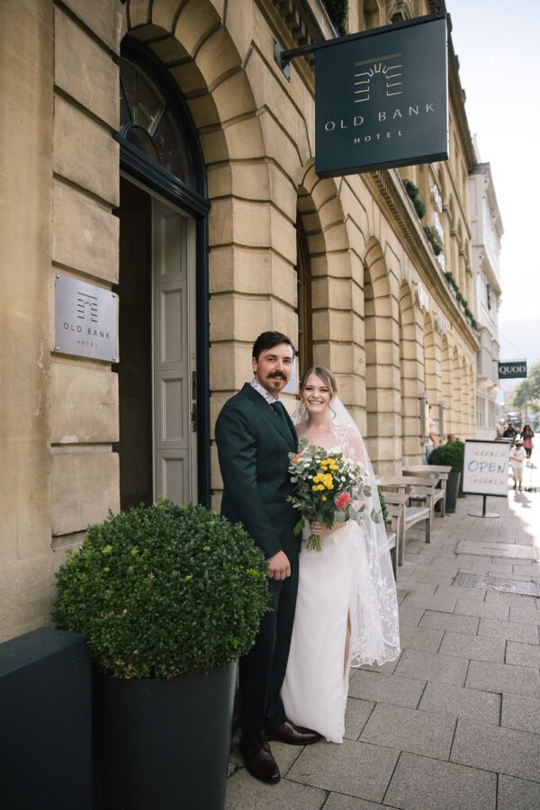 Modern wedding fashion in front of the Old Bank Hotel, Oxford architecture as the perfect backdrop