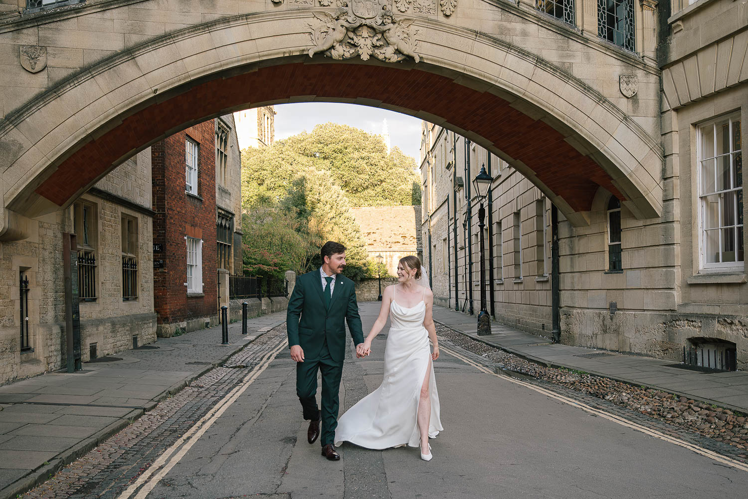 Duke Humphrey’s Elopement-33 Elopement couple walking under the Bridge of Sighs